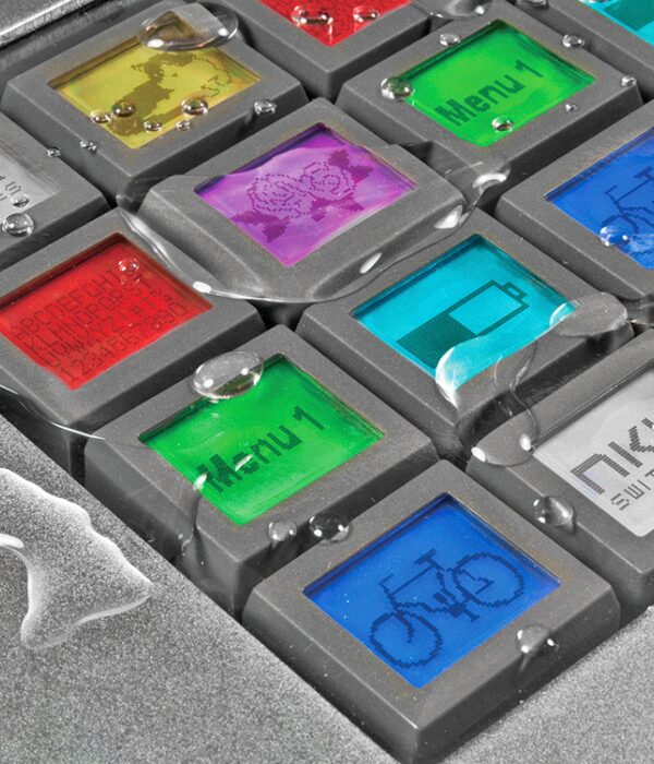 SmartDisplay OLED pushbuttons shown with optional splashproof polyurethane overlay and mounting bracket for added environmental protection.
