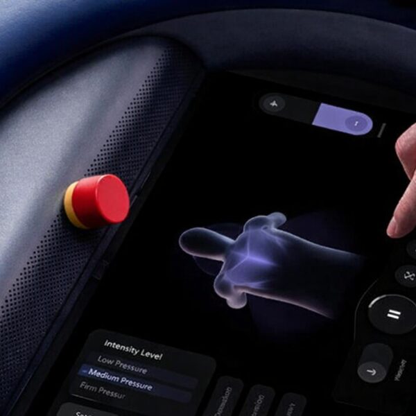 Patient facing interface with touch screen and integrated E-Stop 25mm actuator with no legends.